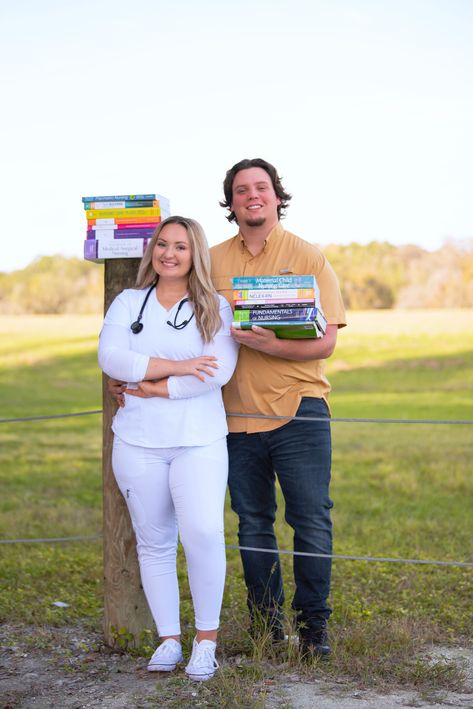 Nursing student graduation pictures with textbooks and boyfriend Nurse Graduation Pictures With Family, Nursing Graduation Pictures With Husband, Nursing School Graduation Pictures With Family, Nursing Graduation Pictures With Kids, Nursing School Pictures, Graduation Pictures With Boyfriend, Graduation Pictures With Family, Nursing Pics, Nursing School Graduation Pictures