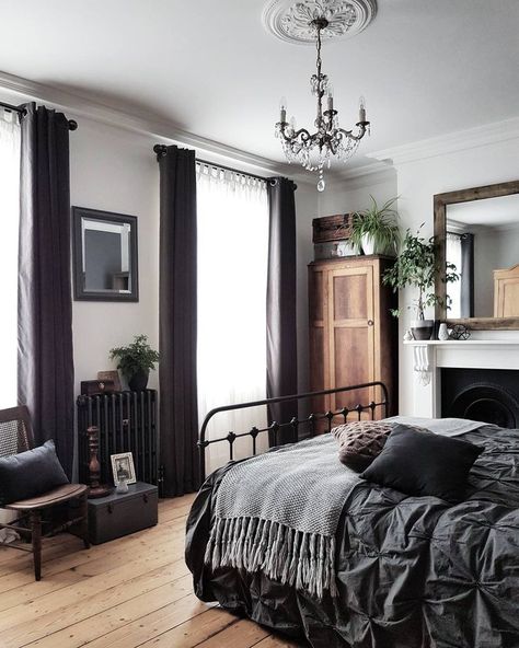 gorgeous details in white bedroom with dark curtains, chandelier, dark grey pintuck bedding, and an iron bed frame. Fireplace in bedroom. Black radiator in bedroom. Minimalist Dekor, Interior Design Minimalist, Light Wood Floors, Bedroom Black, Trendy Bedroom, Elegant Bedroom, Home Design Decor, Modern Bed, Dream Bedroom