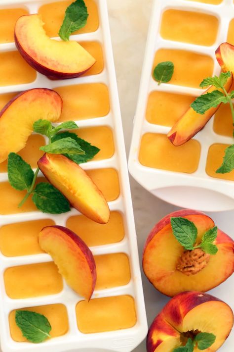 These Summer Peach Ice Cubes scream of summer and they add a delicious pop of flavor to your favorite iced tea. You can use fresh peaches when they’re juicy and ripe in season, but frozen organic peaches work just as well. Drink Recipes Healthy, Clean Eating Healthy Recipes, Healthy Drink Recipes, Ice Cube Recipe, Fruit Ice Cubes, Flavored Ice Cubes, Yummy Summer Drinks, Spiced Tea, Flavored Ice