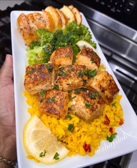 Shay Dolce - Garlic Butter Salmon Bites over Yellow Rice,... Yellow Rice Meals, Garlic Butter Salmon Bites, Rice Broccoli, Salmon Bites, Garlic Butter Salmon, Butter Salmon, Soul Food Dinner, Yellow Rice, Easy Healthy Meal Prep