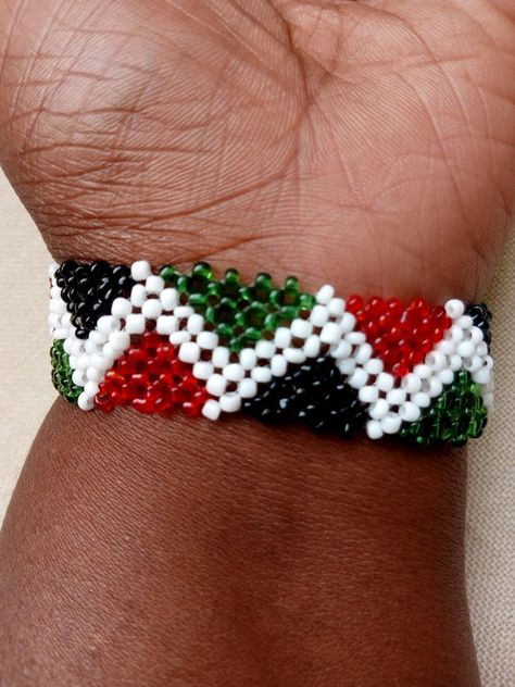 Check out this item in my Etsy shop https://www.etsy.com/listing/638770893/zigzag-kenyan-flag-colors-handmade Kenya Bracelet, Peace Color, Kenyan Flag, Zimbabwe Flag, Kenya Flag, Flag Beads, Handmade Leather Bracelets, Handmade Sandals, Patriotic Flag