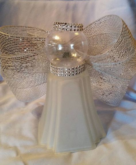 I used a light globe from a ceiling fan, glued on a clear ornament, and added ribbon for wings and used bling to accessorize.  Beautiful table top decor.  About 9 in.tall. Angel Crafts Using Ceiling Fan Globes, Fan Globe Crafts, Fan Globes Repurpose, Upcycle Ceiling Fan Globes, Ceiling Fan Light Globes Crafts, Ceiling Fan Globe Crafts, Repurpose Ceiling Fan Globes, Light Globe Crafts, Light Globes Repurposed