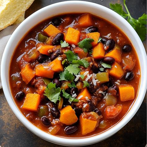 Healthy and hearty Sweet Potato Black Bean Chili recipe, a vegan-friendly dish packed with flavor and perfect for meal prep. Sweet Potato Black Bean Chili Instapot, Sweet Potato And Black Bean Chili, Sweet Potato Chili Crockpot, Black Bean Sweet Potato Chili, Black Bean Chili Recipe, Sweet Potato Chili Recipe, Butternut Squash Black Bean, Sweet Potato Black Bean Chili, Chili Recipe With Black Beans