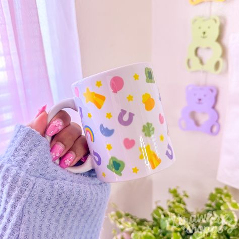 Obsessed with this simple but adorable lucky charms mug! 🥹💕| #kawaii #cereal #luckycharms #pastelaesthetic #aesthetic #sublimation #cutemug #mug #mugcake #glasscan #homedecoration #kitchenware #kitchenaccessories | Cute Painted Mugs Aesthetic, Kawaii Mug, Lucky Charms, Chunky Mugs Aesthetic, Awsthetic Mug, Kawaii Ceramic Mugs, Kawaii Glass Cup, Daisy Scouts, Pretty Mugs