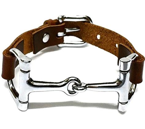 PRICES MAY VARY. Handcrafted bracelet with top grain leather with classic horse charm One size fits all Top Grain Cowhide Leather Unique horse gift for horse lovers and equestrians Unisex for him and her Horse Bit Bracelet This Horse Bit Bracelet is a signature classic equestrian jewelry. It is handcrafted in our own studio and it is our own original classic design since 2015. Inspired by equestrian fashion and style, this bracelet comes with a snaffle horse bit attached to top grain leather str Western Fashion Jewelry, Horse Bracelet, Snaffle Bit, Cowgirl Tuff, Equestrian Fashion, Equestrian Jewelry, Horse Jewelry, Luxury Bracelet, Horse Gifts