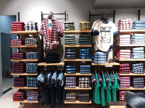 Shirt Display Ideas Retail Store Design, Shirt Wall Display, Shirt Display Ideas, Display Ideas Retail, Denim Display, Alchemist Book, Clothing Store Displays, Clothing Store Interior, Retail Fixtures