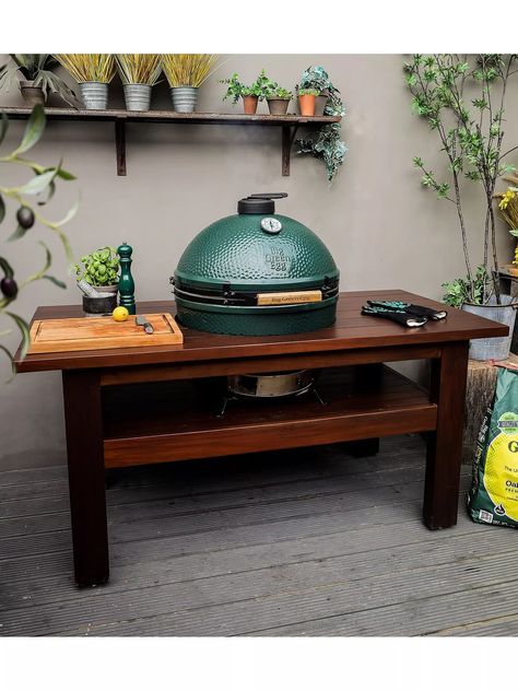 The ceramic Big Green Egg charcoal barbecue combines age-old know-how and state-of-the-art technology to offer incredible strength, durability and heat insulation. Ideal for large gatherings, this Extra Large Big Green Egg creates powerful flavours and has excellent temperature control and moisture saturation for tender cooking.  This XL Big Green Egg bundle includes a large mahogany wood table and table nest, plus a cover to protect the Egg and table when not in use. The Egg has a large gauge f Big Green Egg Table, Egg Bbq, Bbq Cover, Big Green Egg, Cooking Accessories, Green Eggs, Mahogany Wood, Art Technology, The Egg