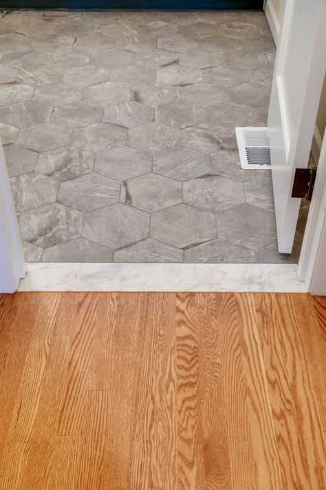 The Carrara Marble threshold between the hardwood flooring in the bedroom to the bathroom tile add a period detail to the new space. Marble Threshold, Building A Home, Primary Suite, Marble Flooring, Home Addition, New Space, Bathroom Tile, Carrara Marble, Hardwood Flooring