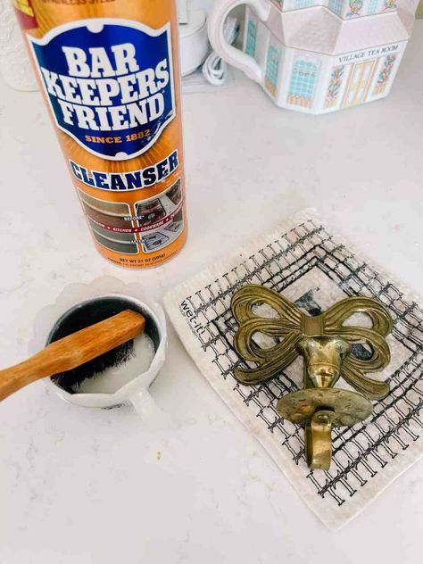 how to clean brass and remove tarnish with this diy. It works for hardware items, candlesticks, door handles, knobs, and hinges. How to polish tarnished brass so it shines with barkeeper's friend and ketchup regular household products Brass Cleaner Diy Homemade, Clean Brass Diy, Polish Brass Diy, How To Clean Brass Remove Tarnish Diy, How To Clean Metal Hardware, How To Clean Brass Candlesticks, How To Clean Brass Door Handles, Cleaning Brass Hardware, Brass Cleaner Diy