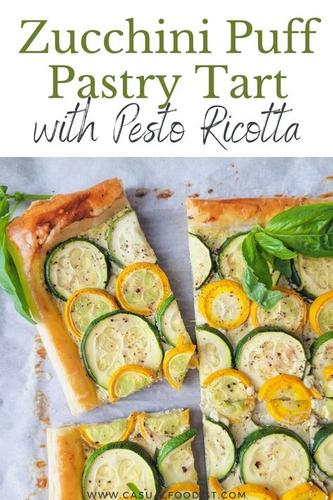 Ready in under 30 minutes this Zucchini Puff Pastry Tart with Pesto Ricotta is the perfect summer appetizer. Discover the best recipe for an easy and delicious zucchini puff pastry tart. | zucchini tart with puff pastry | zucchini tart with ricotta | zucchini tart with pesto | zucchini appetizer recipe | vegetable tart recipe | Zucchini Ricotta Pesto Tart, Puff Pastry Zucchini Tart, Zucchini Tart Puff Pastries, Zucchini Appetizers For Party, Puff Pastry Zucchini, Aperitivo Party, Zucchini Appetizer Recipes, Tart With Puff Pastry, Vegetable Tart Recipes