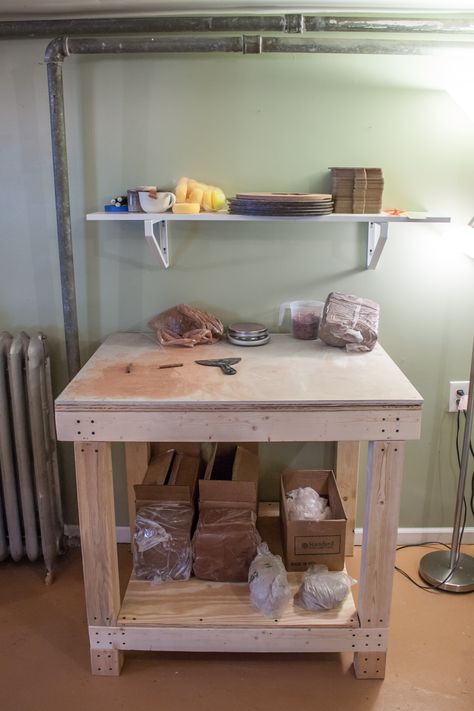 My custom build wedging table with a cement board top. Clay is stored underneath. Bats and sponges live on the wall shelf above. Clay Wedging Table Diy, Ceramic Studio Ideas, Clay Table, Home Studio Ideas, Pottery Table, Cement Board, Shed Interior, Pottery Lessons, Art Studio Design