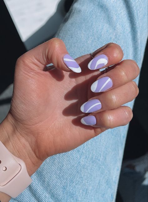 lilac acrylic almond shaped nails | purple nail inspo | nails with white swirls | purple and white nails | purple nails with white swirls | almond shape nails inspo Lavender Nails With White Design, Lilac Swirl Nails, Purple And White Nail Art, Lavender And White Nails With Design, Almond Shaped Nails Purple, Purple Line Nails, Almond Nails Lilac, Acrylic Nails Lilac, Lilac And White Nails