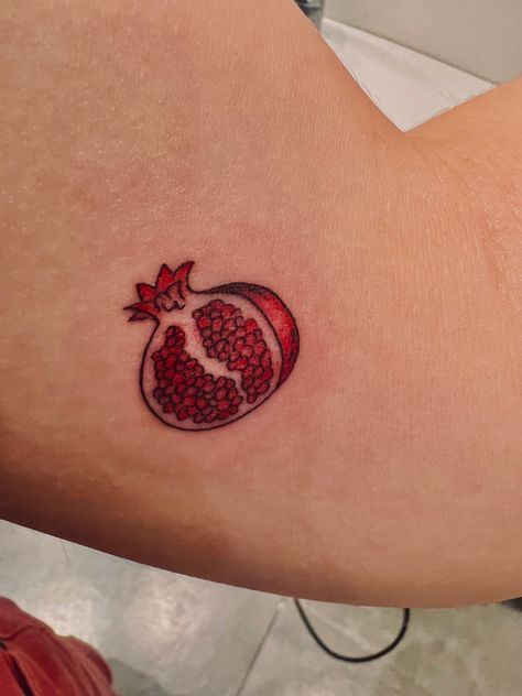 A red tattoo of half a pomegranate Tattoo Ideas Pomegranate, Biro Doodles, Pomegranate Tattoo, Tattoos 2024, Night Tattoo, Dot Tattoos, Animation Reference, Text Pictures, Skin Art