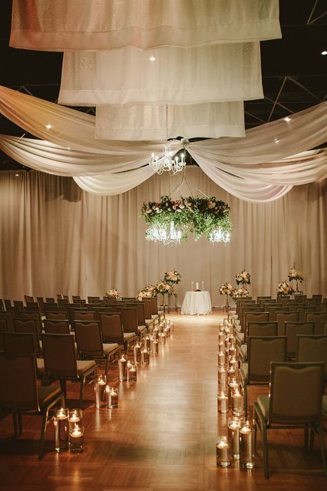 Statler Hotel wedding with suspended floral chandelier of eucalyptus and smilax with peach and white flowers. Accompanied by floating candle aisle and draping. Elizabeth Bristol Photography. Candle Aisle, Bristol Photography, Floating Candle Aisle, Wedding Aisle Candles, Starlight Wedding, Aisle Candles, The Jackson 5, Floating Candles Wedding, Dreamscape Architecture