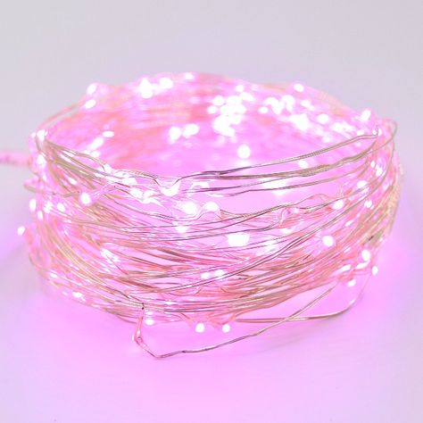 With our LED fairy lights, you can transform anything to look like it came from a storybook. Whether you use these flexible copper fairy lights to add a dreamy vibe to your bedroom, DIY centerpieces, or even fill empty jars, the possibilities are endless. We carry a rainbow of colors to fit every design theme! These lights also come in 6’ and 16.5’ lengths with the option for plug or battery operated. Specifications:  Includes 100 Pink Micro LED lights attached to a 33’ high-quality silver wire. Pastel Led Lights, Pink Room Aesthetic Decor, Cute Led Lights, Copper Fairy Lights, Pink Fairy Lights, Cosy Bedroom Decor, Pink Led Lights, Barbie Wallpaper, Flower Fairy Lights