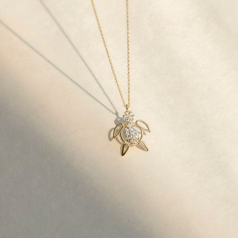 "1- D E S C R I P T I O N Embrace nature's beauty with this 14K Solid Gold CZ Turtle Necklace for Women, featuring a charming turtle pendant adorned with sparkling cubic zirconia stones, adding a touch of elegance and charm to your style. 2- P R O D U C T ∙ F E A T U R E S * Gold material: 14K solid gold * Gold color options: Yellow gold, Rose gold, White gold * Stone: Cubic Zirconia * Choice of chain length: 14\", 16\", 18\", 20\", Pendant Only  * Dimensions:    Pendant Height: 12 mm / 0.47 in Nature-inspired Gold Diamond Jewelry, Necklace Pendant Design, Cute Pendants, Cute Necklaces, Nature Friendly, Nature Necklace, Solid Gold Necklace, Turtle Necklace, Turtle Pendant