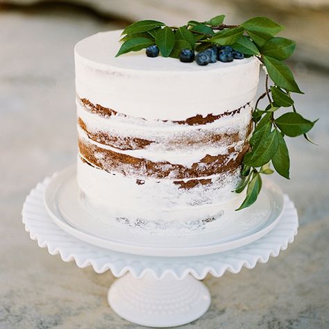 White Wedding CakeThe white cake gets a rustic feel with a semi-naked finish and organic topper of greenery and blueberries. White Wedding Cakes the Traditionalist Will Love  #wedding#cake#white#naked#cake#blueberries#rustic Chill Bride, Lovely Cake, Delicious Sweets, Elegant Wedding Inspiration, Naked Cakes, Practical Wedding, Wedding Dessert, White Wedding Cakes