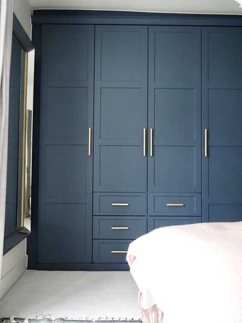 Step inside interior stylist Maxine Brady's cool bedroom redesign that is filled with clever storage ideas, pretty wallpaper and navy fitted wardrobes to create a dreamy room Navy Bedroom Wardrobes, Coloured Fitted Wardrobes, Navy Wardrobe Bedroom Ideas, Navy Dressing Room, Navy Wardrobe Doors, Navy Fitted Wardrobes, Navy Blue Wardrobe Bedroom, Painting Wardrobes Ideas, Navy Wardrobe Bedroom