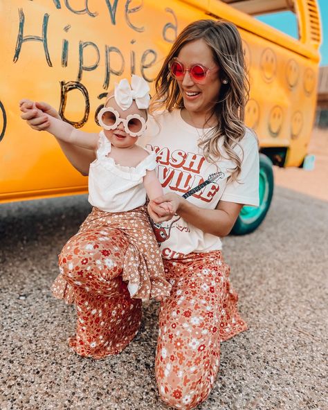 Mom and daughter 70s outfit. Matching bell bottoms. I’m front of hippy van. Daisy sunglasses. Matching mama and mini. Floral bell bottoms, graphic tee, baby girl outfit Two Groovy Mom Outfit, Groovy Mom Outfit, Future Cowboy, Hippy Party, Hippy Life, Matching Mommy Daughter Outfits, First Baby Pictures, Fair Pictures