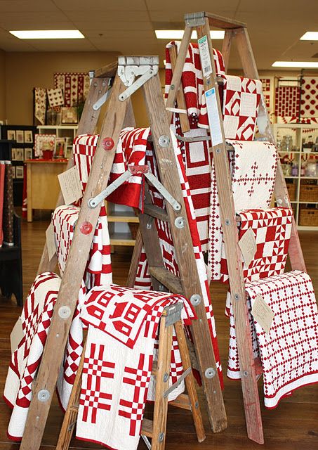 Red and white at Temecula Quilt Co. - how cool to have the whole store in red and white! Quilt Shop Displays, Wooden Ladders, Quilt Ladder, Store Display Ideas, Quilt Display, Two Color Quilts, Craft Fairs Booth, Red And White Quilts, Quilt Rack