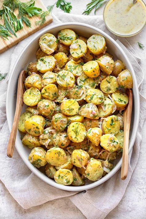 This savory French potato salad with fresh herbs and shallots is a light and vibrant pick, dressed in a mustard vinaigrette instead of mayo! | thecozyapron.com #frenchpotatosalad #frenchpotatosaladrecipe #frenchpotatosaladwithtarragon #frenchpotatosaladdressing #frenchpotatosaladnomayo Baby Yellow Potatoes, Baby Potato Salad, Salad With Fresh Herbs, French Potato Salad, Salad Meals, Loaded Baked Potato Salad, French Potatoes, Baked Potato Salad, Mustard Vinaigrette