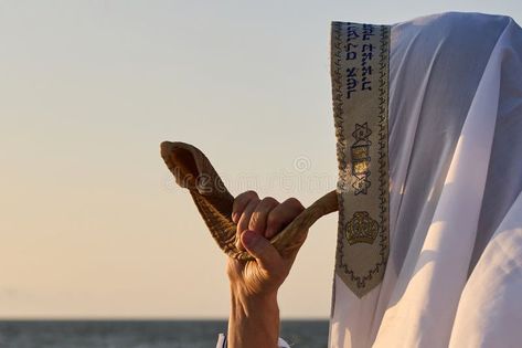 Jewish man blowing the Shofar rams horn on Rosh Hashanah and Yom Kippur day. stock photography Rams Horn, Jewish Men, Ram Horns, Yom Kippur, Photography Day, Rosh Hashanah, Clear Sky, Horn, Stock Photography