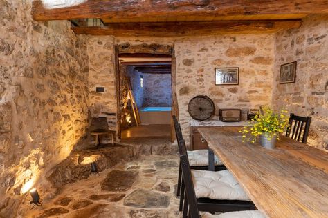 The project concerns the renovation study and then its implementation, in an existing stone house of 1931 in the mountainous Mylopotamos of Crete. The house consists of two floors, a ground floor with a terrace and a basement, twice the size of the space, which extends both in the area of ​​the main use of the house and in the terrace, creating a long narrow space, without natural light and ventilation. Visit zeropixel.gr for more. Mountain House Interior, Small Stone House, Rustic Stone, Unique Architecture, The Terrace, Mountain House, Stone House, Stone Flooring, Crete