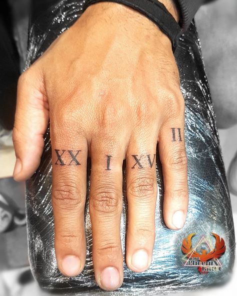 Roman Numerals Finger Tattoo, Roman Numeral Tattoo On Finger, Greek Mythology Finger Tattoos, Finger Roman Numeral Tattoo, Date On Finger Tattoo, Numbers On Fingers Tattoo, Roman Numeral Hand Tattoo, Greek Numbers Tattoo, Roman Numeral Tattoo Finger