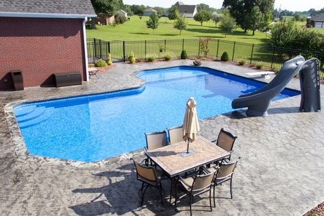 Somerset Grecian Vinyl Inground Diving Pool with Corner Step, Tanning Ledge, Slide, Concrete Coping, and Custom Patio L Shaped Pool With Tanning Ledge, L Shaped Pool, Pool With Tanning Ledge, Pool With Hot Tub, Inground Pool Landscaping, Edge Pool, Wade In The Water, Diving Pool, Tanning Ledges