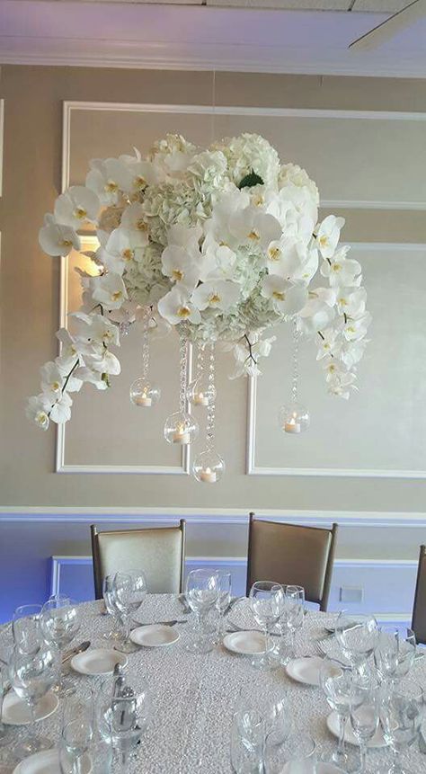 Suspended arrangement of hydrangea and orchids Floating Orchid Centerpiece, Orchids And Hydrangeas Centerpiece, Orchid Wedding Theme, Flower Ball Centerpiece, Orchid Bridal Bouquets, Orchid Centerpiece, White Wedding Centerpieces, Hanging Orchid, Orchid Flower Arrangements