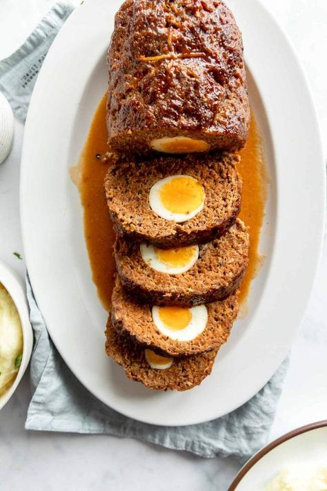 Beef Meatloaf with Eggs is a wonderful main dish recipe, perfect for special dinners. Juicy beef meatloaf with eggs in the middle, served with a rich meatloaf sauce. This is perfect for Sunday roast and festive dinners like Christmas or Easter. Easy recipe with all the tips and tricks you need. #meatloaf #meatloafwitheggs #meatloafrecipe #christmasdinner #easterdinner #dinnerecipes #roast