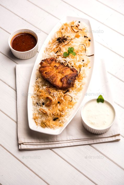 Authentic Fish Biryani by stockimagefactory. Authentic Fish Biryani served with yogurt dip #Sponsored #Biryani, #Fish, #Authentic, #stockimagefactory Bangalore Days, Fish Biryani, Fish Bar, Zany Malik, Yogurt Dip, Food Crush, Biryani Recipe, Basmati Rice, Biryani