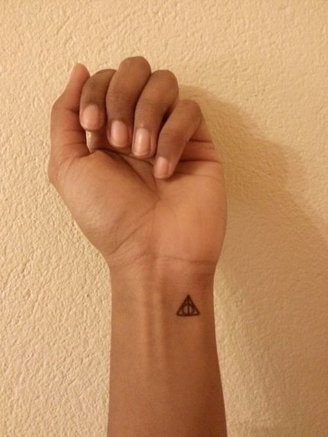 Deathly Hallows Tattoo- i want this on the bottom part of my ankle Tattoo Ideas Harry Potter, Tattoo Ideas Symbols, Hallows Tattoo, Small Symbols, Tattoo Ankle, Tattoo Wrist, Harry Potter Tattoos, Harry Potter Tattoo, Elephant Tattoos