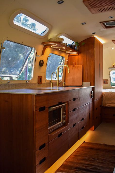 Photo 10 of 15 in Budget Breakdown: He Singlehandedly Gave a ’76 Airstream a Redwood Reinvention for $180K - Dwell Airstream Outdoor Space, Air Stream Remodel, Airstream Living, Action Board, Glamper Camper, Airstream Remodel, Airstream Interior, Airstream Renovation, Laminate Counter