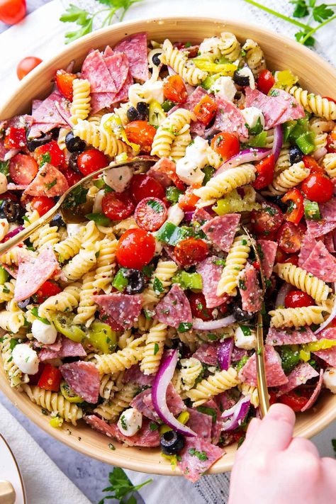 The Italian Pasta Salad is packed with meat, cheese, pasta, and zesty Italian dressing, topped with parmesan. It also includes red onion, pepperoncini, black olives, and fresh vegetables for a flavorful dish. | Recipe at BeamingBaker.com Awesome Pasta Salad, Italian Pasta Salad Recipes, Fresh Mozzarella Recipe, Italian Dressing Pasta Salad, Spaghetti Pasta Salad, Vegetable Pasta Salad, Salad Italian, Italian Dressing Recipes, Summer Pasta Salad Recipes