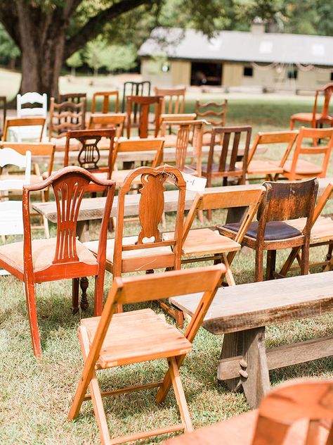 Make your guests feel unique with modern, mismatched seating at your rustic wedding ceremony. Chairs with worn wood have the prime look for the theme. Mismatched Wooden Chairs Wedding, Thrifted Chair Wedding, Wooden Chairs Wedding Ceremony, Thrifted Wedding Chairs, Thrifted Chairs Wedding, Adirondack Wedding Decor, Thrift Shop Wedding, Wooden Wedding Chairs, Wooden Chairs Wedding