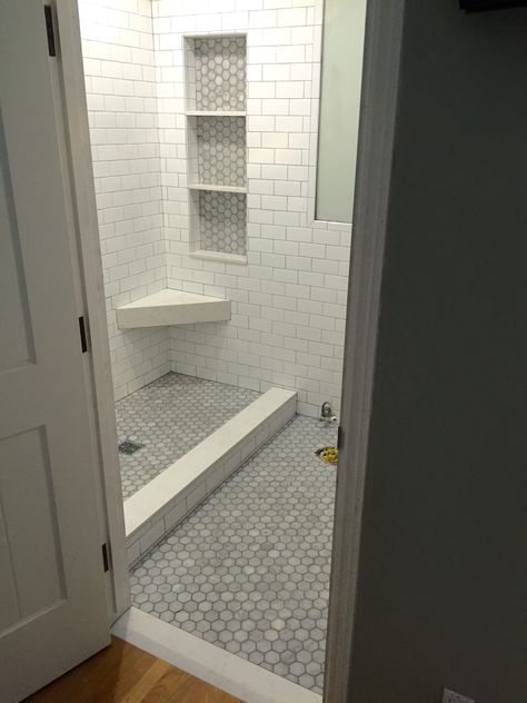 Quartz shampoo niche, shower bench, shelves, triangle bench, marble mosaic octagon Shower With Triangle Bench, Shower Triangle Bench, Shower Corner Bench, Shampoo Niche, Beach House Bathrooms, White Subway Tile Shower, Tile Shower Niche, Bath Bench, Condo Bathroom