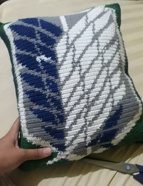 Did this as a gift for my cousins 18th birthday. Took me about 3 months to finish of non-continuous work. I used a grid pixel art for the pattern and single crochet for the stitches. Back part is plain green but if you want to do it the same way as the front, you still can but I will warn you about the tiring labor first hand.🤭 Wings Of Freedom, 18th Birthday, Single Crochet, 3 Months, Pixel Art, Labor, Crochet Blanket, Do It, Pillows