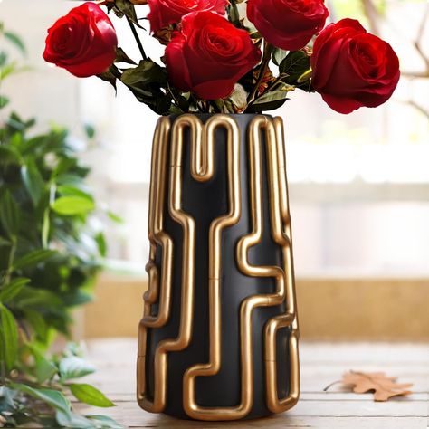 A blend of modern simplicity and charm. Elevate your home decor with its vibrant line design. The decorative flower vase's distinctive shape and adorable style are perfect additions to your decor collection. Bring a touch of uniqueness to your space. Black And Gold Vase, Eclectic Room Decor, Aesthetic Flower Vase, Tall Vase Decor, Eclectic Room, Fun Planters, Modern Vases, Gold Vase, Resin Planters