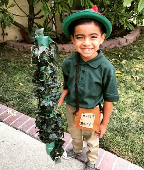 Character Day - Jack and the Beanstalk. Used his uniform shirt and pants. Two sheets of felt ($0.40 each) and brown yard to make magic beans bag. Grabbed a needle and string and stitched it together. Beanstalk is a green pool noodle cut in half with green fake leaves Michael’s ($2.99). Green Hat Amazon ($3.99). Cute, easy, and affordable! Jack And The Beanstalk Costume Diy, Jack And The Beanstalk Costume, Beanstalk Costume, Fairy Tail Books, Fairytale Halloween, Fairytale Ball, Book Characters Dress Up, Character Day, Theater Play