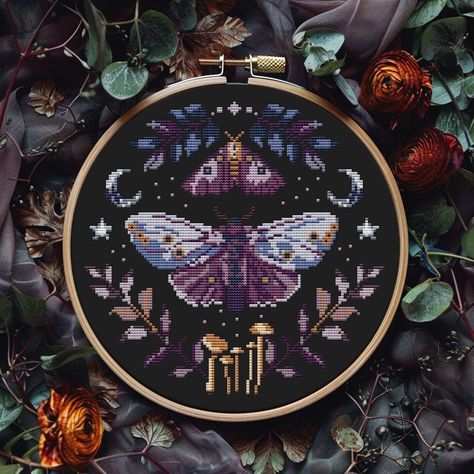 🖤 The design by me, the license is not for sale, but you can sell finished cross stitch 🖤 Gothic moth cross stitch pattern PDF Fabric: 14-count Floss: DMC Dimensions: 111 stitches wide x 109 stitches tall, 7.9 x 7.8 inches (20.1 x 19.8 cm) 9" hoop Included in this easy to read PDF pattern: * printable version of final stitched product  * colour symbol chart * color floss legend with DMC This PDF counted cross stitch pattern available for instant download. No fabric, floss or materials are incl Cross Stitch Moth Pattern, Cross Stitch Patterns Witchy, Wicca Cross Stitch, Cross Stitch Charts Free Pattern, Cross Stitch Designs Pattern, Witchy Cross Stitch Patterns, Dark Cross Stitch, Witchy Cross Stitch, Moth Cross Stitch