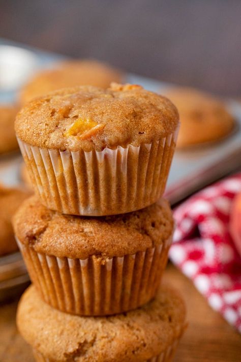 Peach Muffins are a soft, buttery recipe that are perfect for a morning pick-me-up. Made with juicy peaches, brown sugar, cinnamon, and vanilla extract. #breakfast #dessert #muffins #peaches #dinnerthendessert Peach Dishes, Peach Muffins Recipe, Peach Muffin, Peach Muffin Recipes, Cobbler Muffins, Buttery Recipes, Dessert Muffins, Basic Muffin, Church Recipes