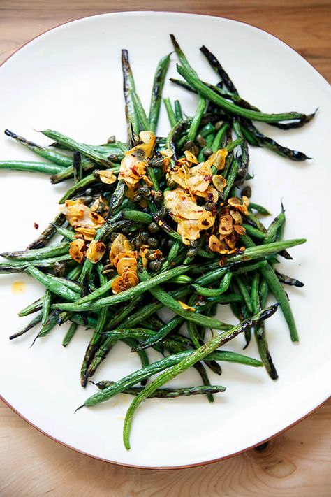 Spicy, blistered green beans with sizzling garlic and capers — so fast and good! Here, green beans blister and char in under 5 minutes under the broiler; meanwhile, in a small skillet on the stovetop, garlic, crushed red pepper flakes, and capers infuse in oil. Together, the combination is irresistible! #greenbeans #broiled #blistered #garlic #chilies #spicy Blistered Green Beans, Alexandra Cooks, Sides Veggies, Green Beans With Garlic, Bon Appetite Recipes, Garlic Green Beans, Crushed Red Pepper, Crushed Red Pepper Flakes, Elephant Ears