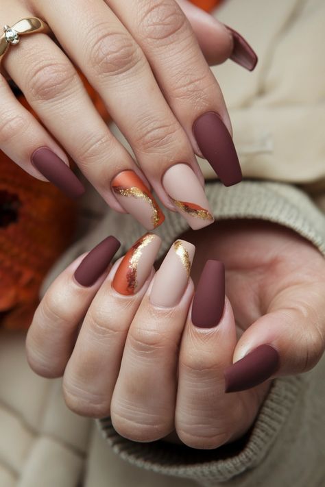 Embrace the essence of autumn with these chic coffin nail ideas that perfectly embody the rich colors and cozy vibes of fall. Picture deep burgundy nails with a matte finish, accented by golden leaf designs that capture the seasonal spirit. This trendy nail style not only highlights the beauty of the season but also adds an elegant touch to any outfit. Get inspired by these stunning fall nail ideas and show off your unique flair! Deep Burgundy Nails, Coffin Nail Ideas, Cozy Colors, Fall Nail Ideas, Latest Nail Designs, Trending Nails, Latest Nail Trends, Sweater Nails, Burgundy Nails