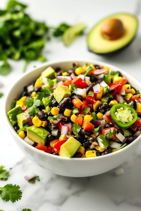 This easy black bean and corn salad is packed with tender black beans, vibrant vegetables, creamy avocado, and a zesty lime dressing. It's perfect for summer picnics, barbecues, or a healthy side dish. Bean Sides, Black Bean And Corn Salad, Bean And Corn Salad, Black Bean Corn Salad, Black Bean Soup Recipe, Black Bean And Corn, Fresh Tortillas, Vegetable Recipe, Black Bean Salad