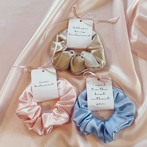 My new silk scrunchies with personalised tags are the cutest accessory to add to your bridesmaid proposals or wedding thank you gifts. Choose the message for your tag which is tied to your scrunchie with a sweet pink ribbon. Image description – 3 silk scrunchies in pale pink, pale golden beige and pale blue. Each has a cardboard wrap around tag tied with a pale pink ribbon and cursive text. The pink scrunchie tag says “Laura Bridesmaid”, the beige scrunchie tag says “Will you be my bridesmai... Bridesmaid Proposals, Wedding Thank You Gifts, Longest Word, Silk Scrunchies, Silk Accessories, Silk Hair, Personalized Tags, Bridesmaid Proposal, Wedding Thank You