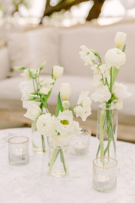 https://freshweddingsandevents.com/ Instagram: @FreshWeddings_CHS Bud Base Center Piece Round Table, White Bud Vase Centerpiece, White And Green Bud Vases, Diy Bud Vases Wedding, Bud Vase White Flowers, Long Table Bud Vases, Bud Vases White Flowers, White Floral Bud Vases, White Flower Bud Vases