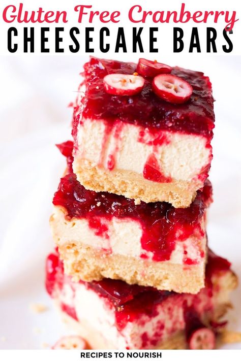 Photo of 3 square slices of thick cranberry sauce topped cheesecake bars stacked on top of each other, garnished with little sliced fresh cranberries with text that says Gluten Free Cranberry Cheesecake Bars. Fall Desserts Healthy, Gluten Free Fall Desserts, Healthy Desserts Gluten Free, Thanksgiving Desserts Cranberry, Cheesecake Bars Recipes, Fall Desserts Gluten Free, Fall Desserts Thanksgiving, Cranberry Cheesecake Bars, Desserts Fall