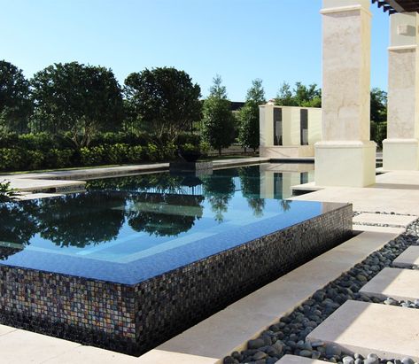 The dark tile finish on both the pool and spa make them into reflecting water features, adding a beautiful tranquil atmosphere to this Central Florida Home. Modern Pool And Spa, Spa Waterfall, Spa Tile, Inside Pool, Dream Backyard Pool, Modern Pool, Residential Pool, Dark Tile, Pool Remodel