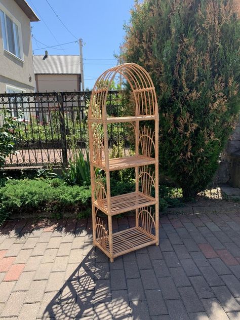 Rattan Plant Shelf, Arched Wicker Bookcase, Boho Coastal Bedroom Decor, Rattan Shelf Styling, Apartment Diy Projects, Wicker Bookshelf, Wicker Wall Shelf, Eclectic Boho Bedroom, Rattan Bookcase